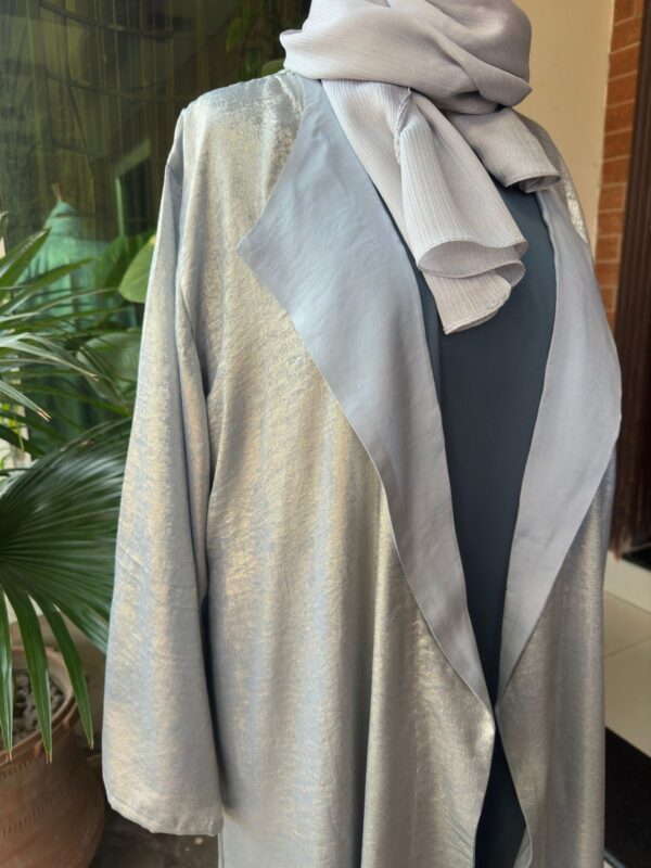 shimmery lava silk gown layered over an inner dress. - Image 3